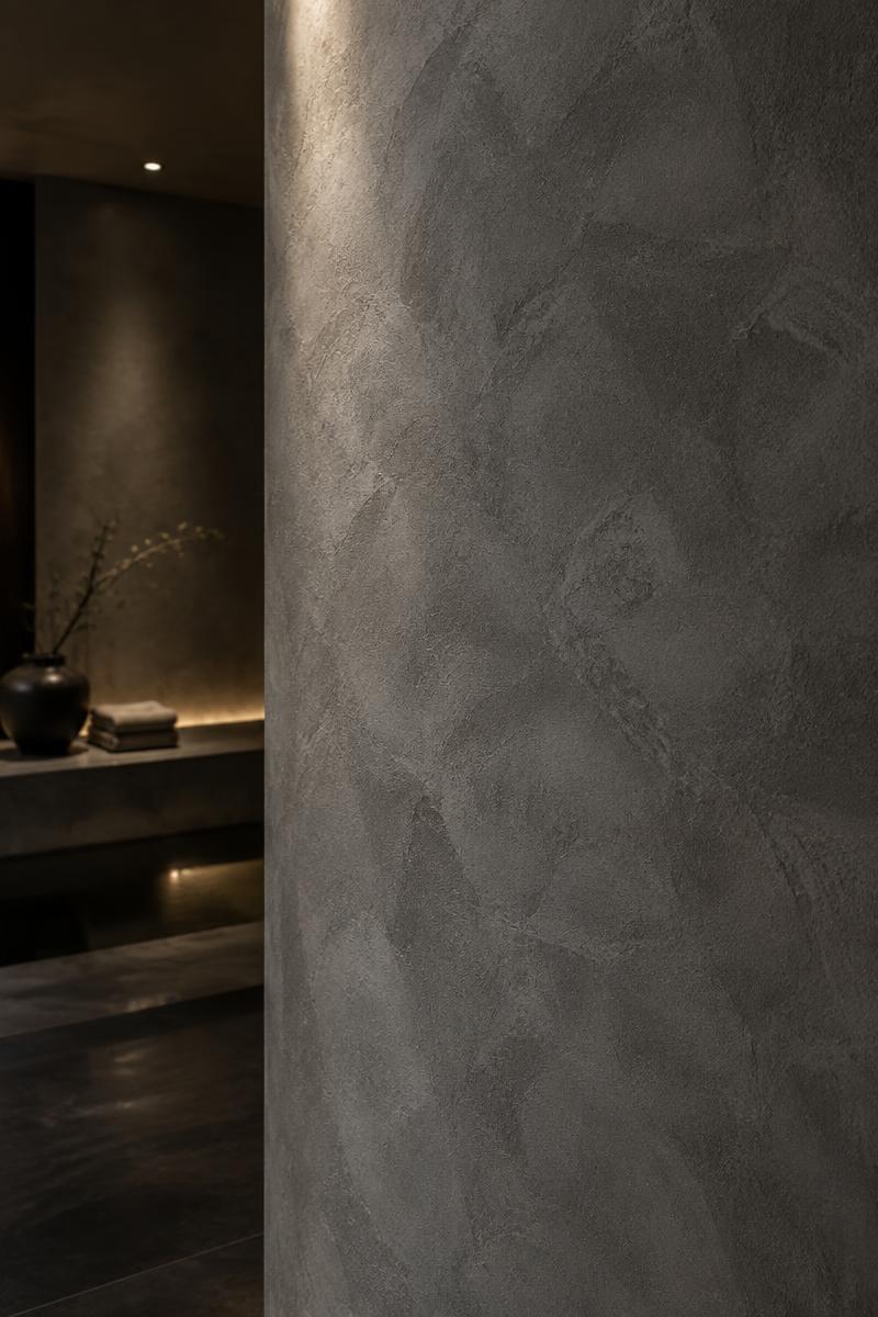 Betonoptik-Wand in dunklem, edlem Interior
